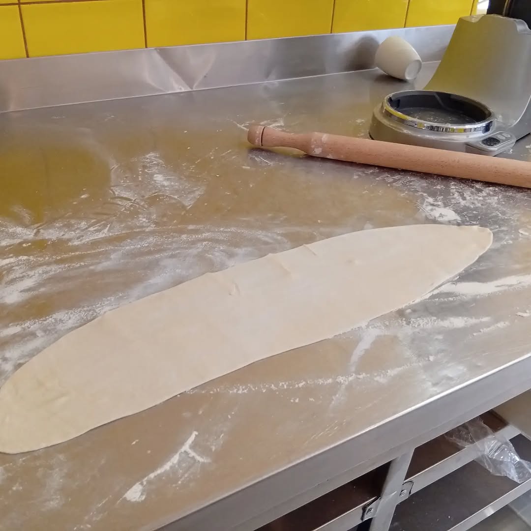 Rolling out handmade pie dough at Marni Breakfast Ikaria